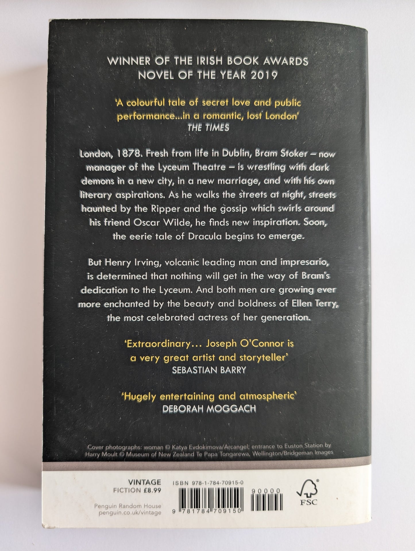 Back cover of a book with text and a barcode on a white background