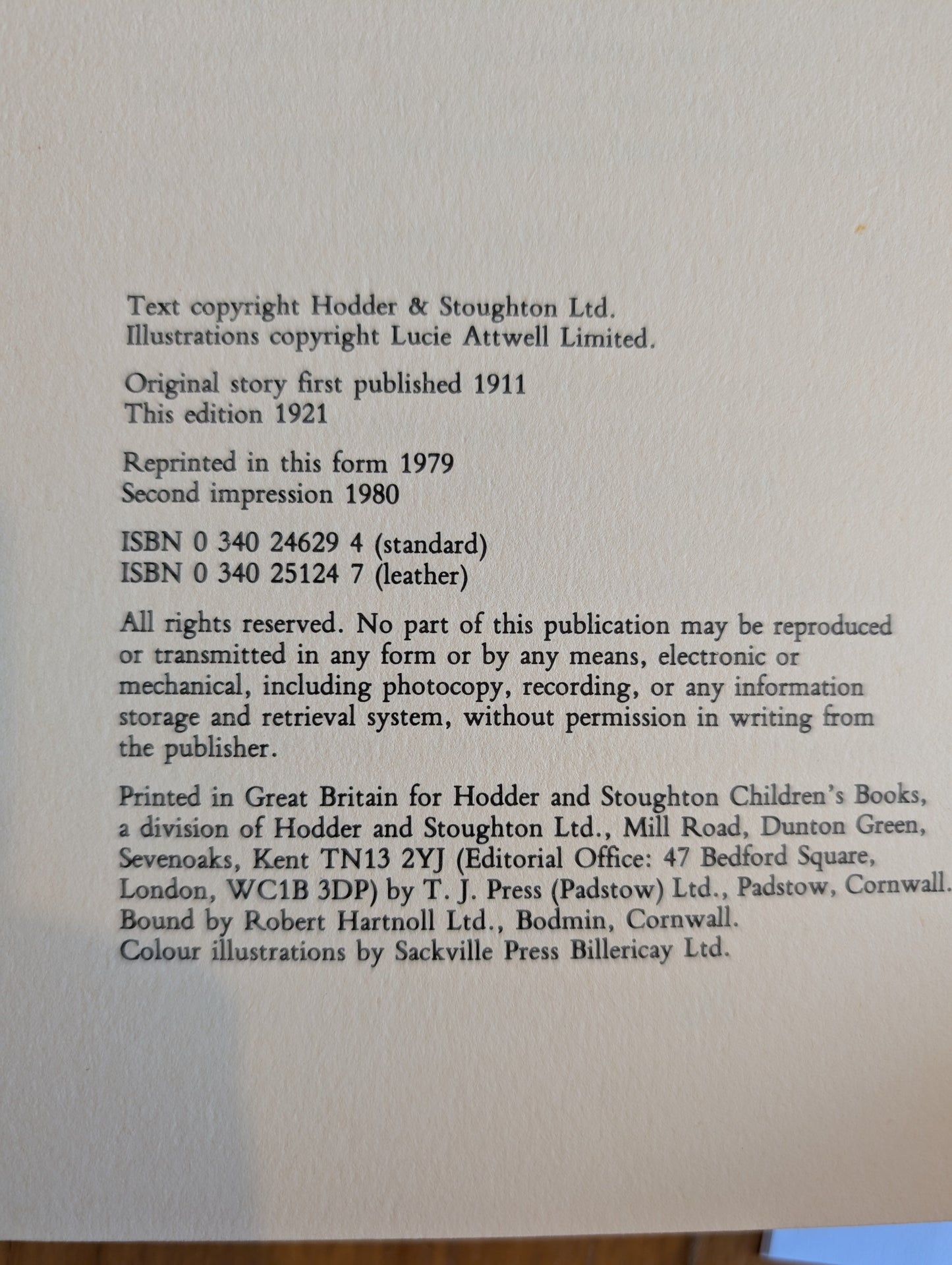 Book page with text copyright information on a light gray background