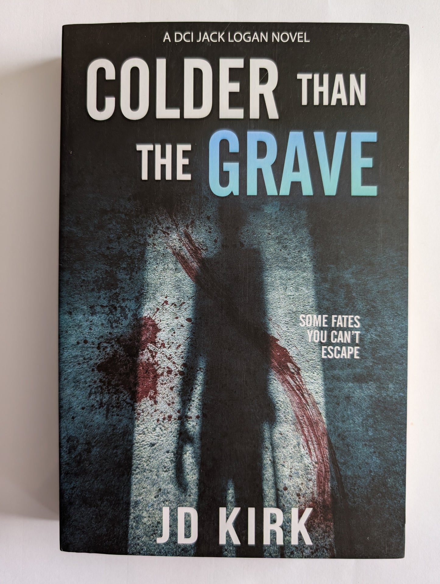 Book cover of 'The Grave Than colder' by J.D. Kirk with a dark and eerie design.