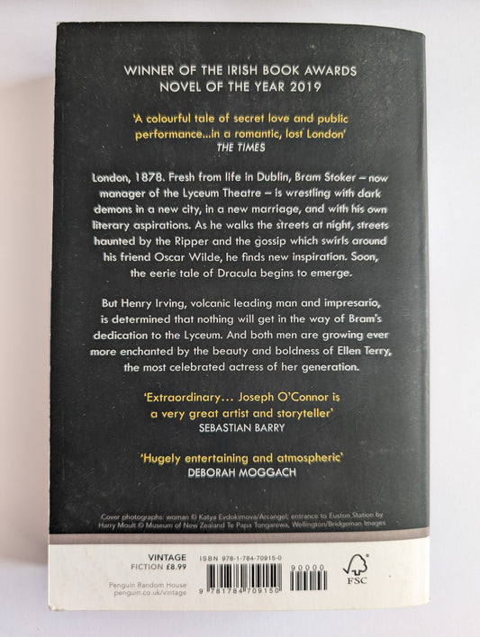 Back cover of a book with text and a barcode on a white background