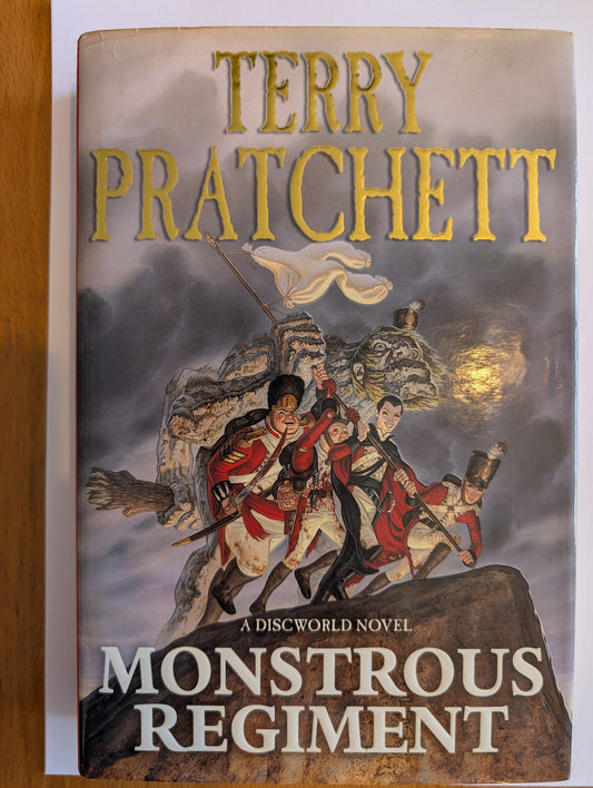 Book cover of 'Monstrous Regiment' by Terry Pratchett with warrior illustration on a cloudy sky background.