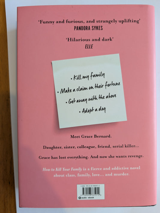 Book cover with a sticky note on a pink background