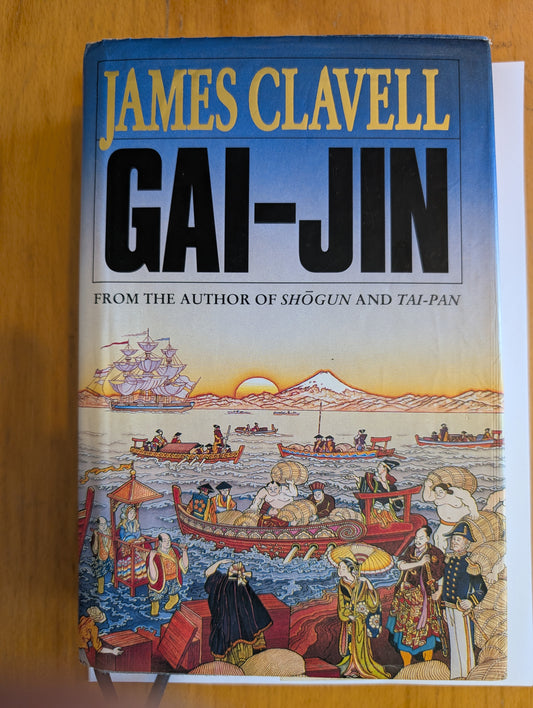 Book cover of 'Gai-Jin' by James Clavell on a wooden surface