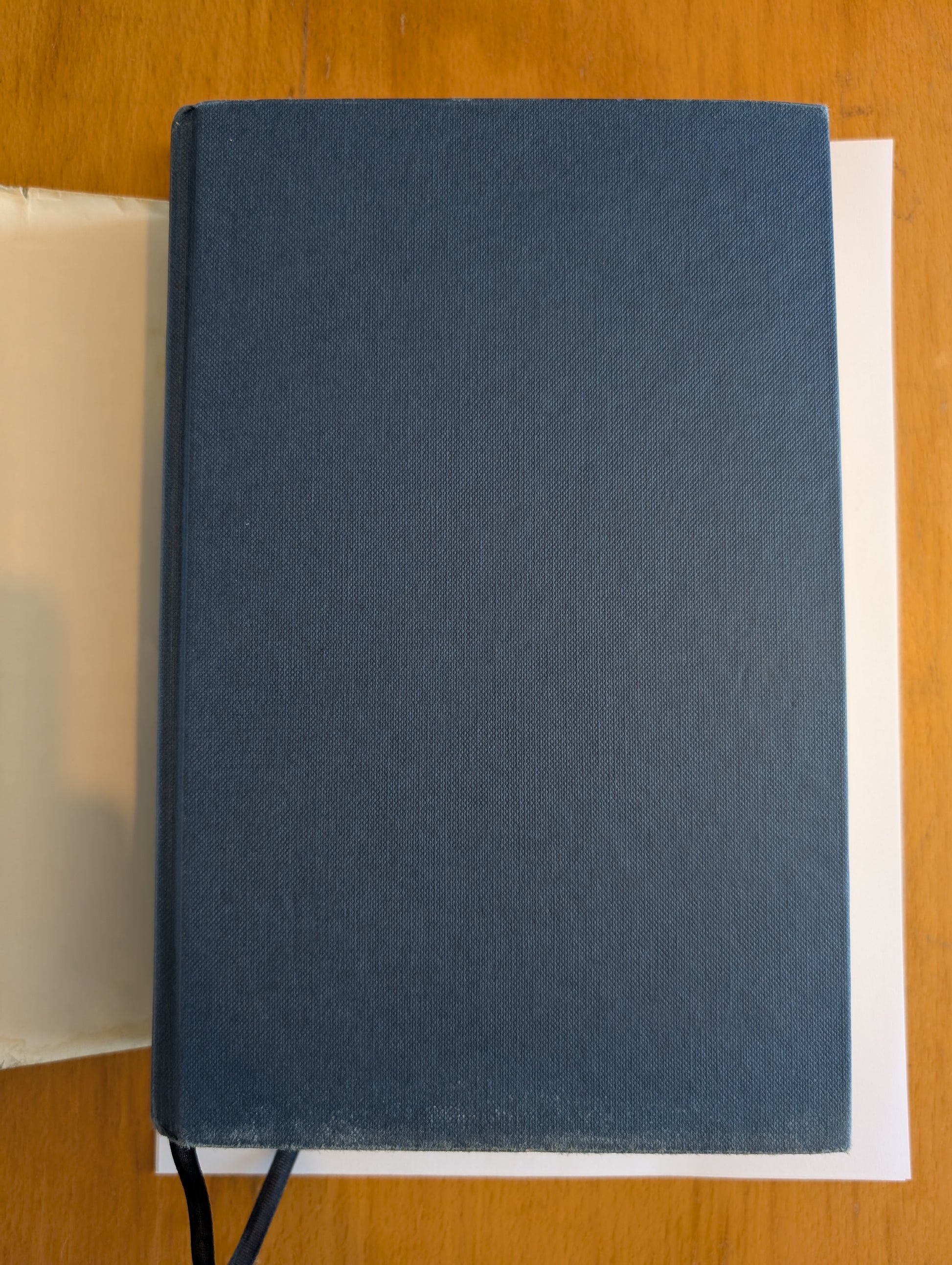 Blue notebook on a wooden surface