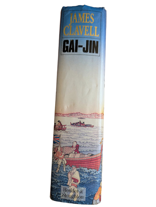 Book titled 'Gai-Jin' by James Clavell on a wooden surface
