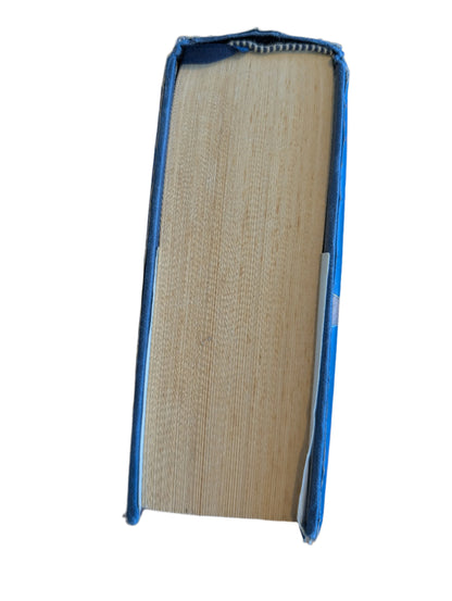 Book with blue spine on a wooden surface