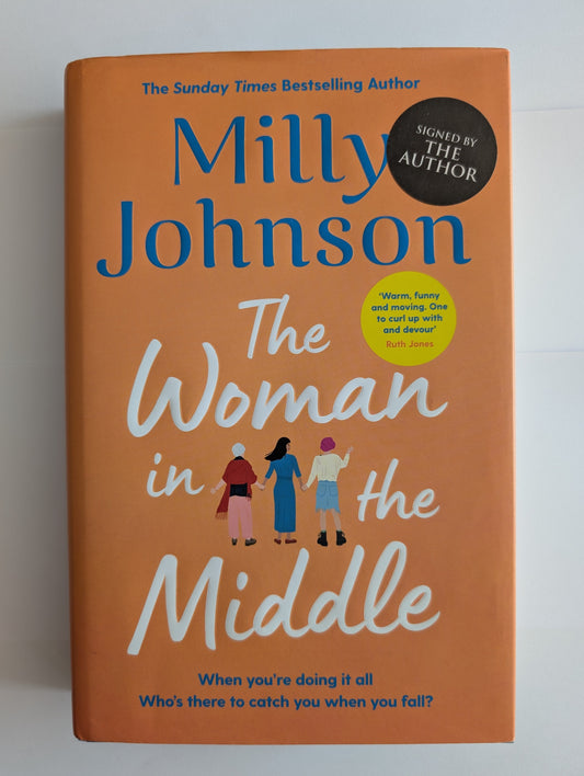 Book titled 'The Woman in the Middle' by Milly Johnson on an orange background