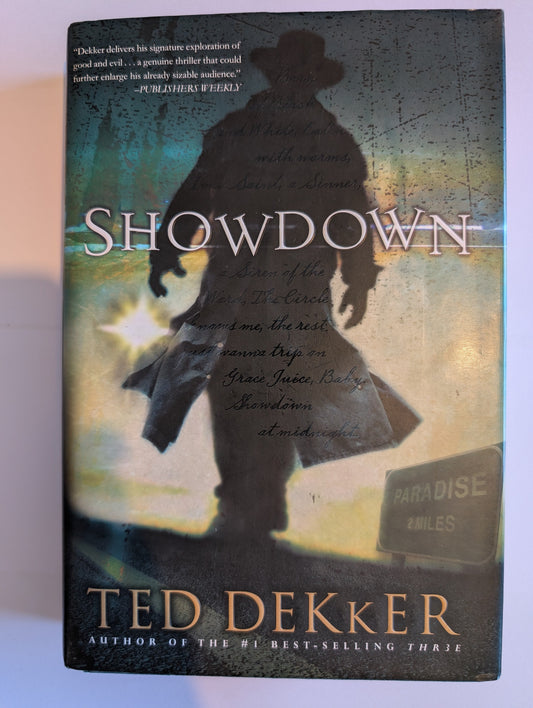Book titled 'Showdown' by Ted Dekker with a silhouette design on the cover.