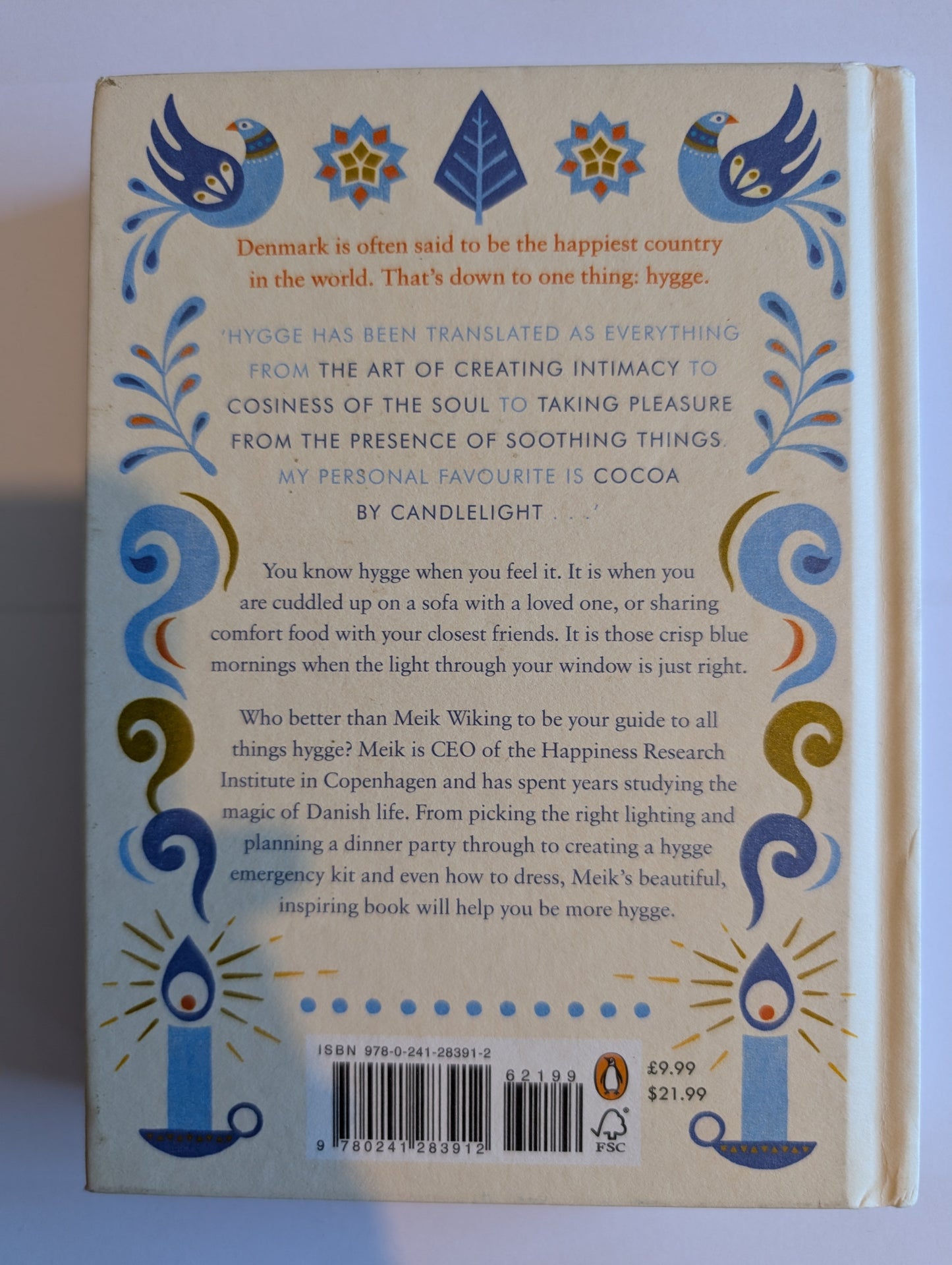 Back cover of a book with decorative elements and text on a white background