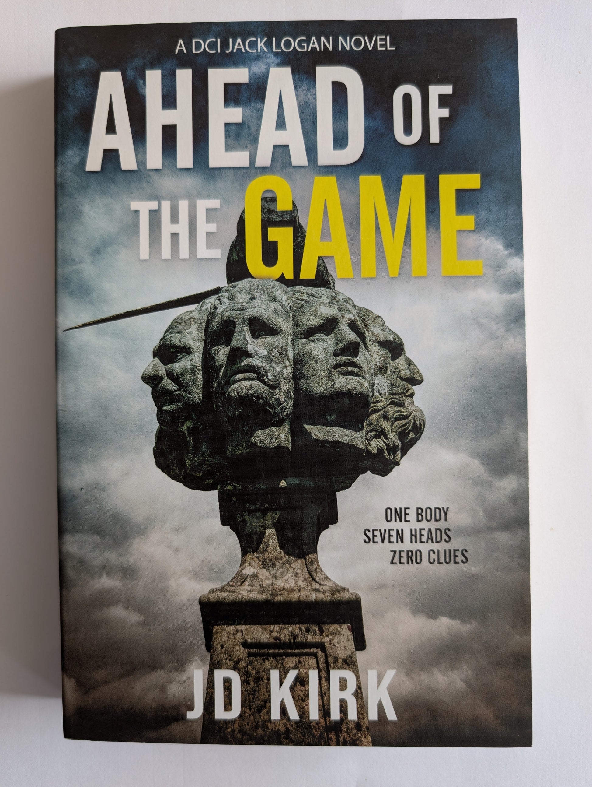 Book cover of 'Ahead of the Game' by JD Kirk with a statue and text on a white background